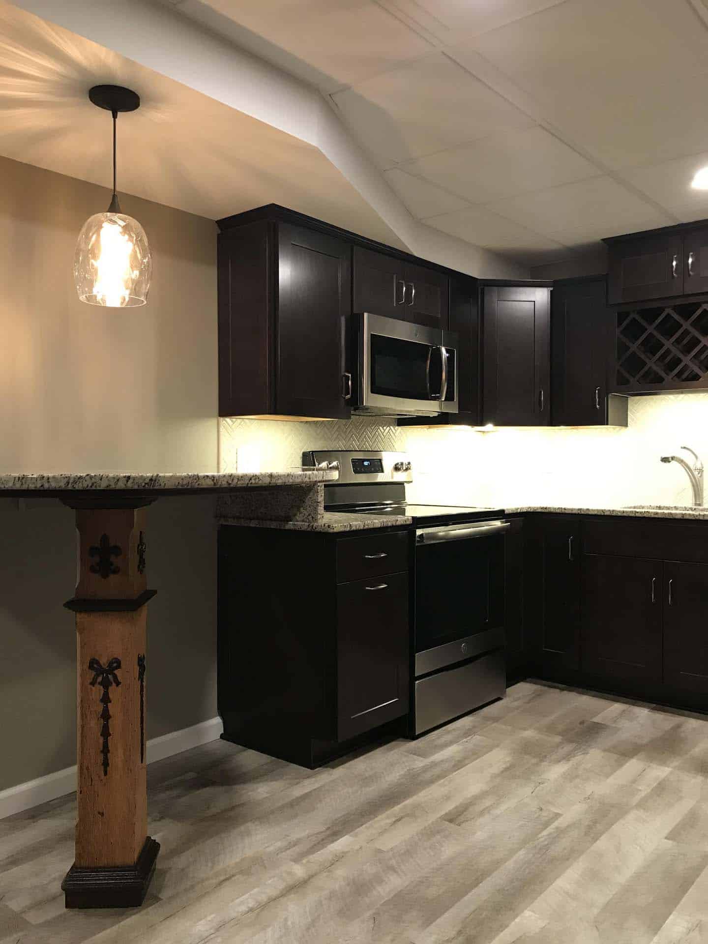 kitchen with black cabinets, tile table